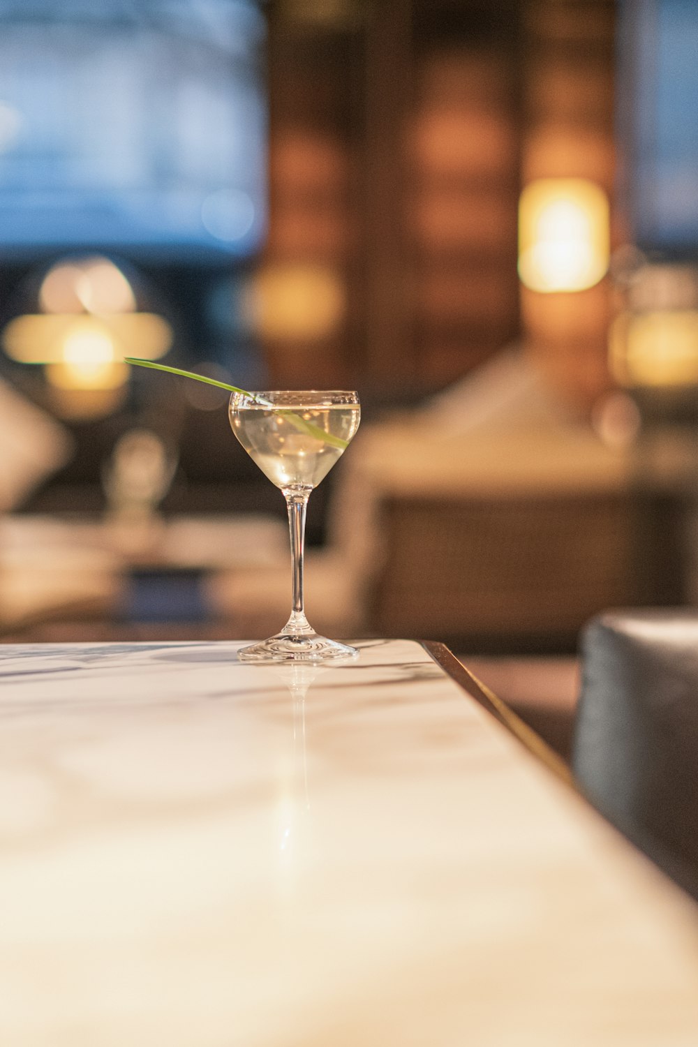 a martini glass sitting on top of a counter