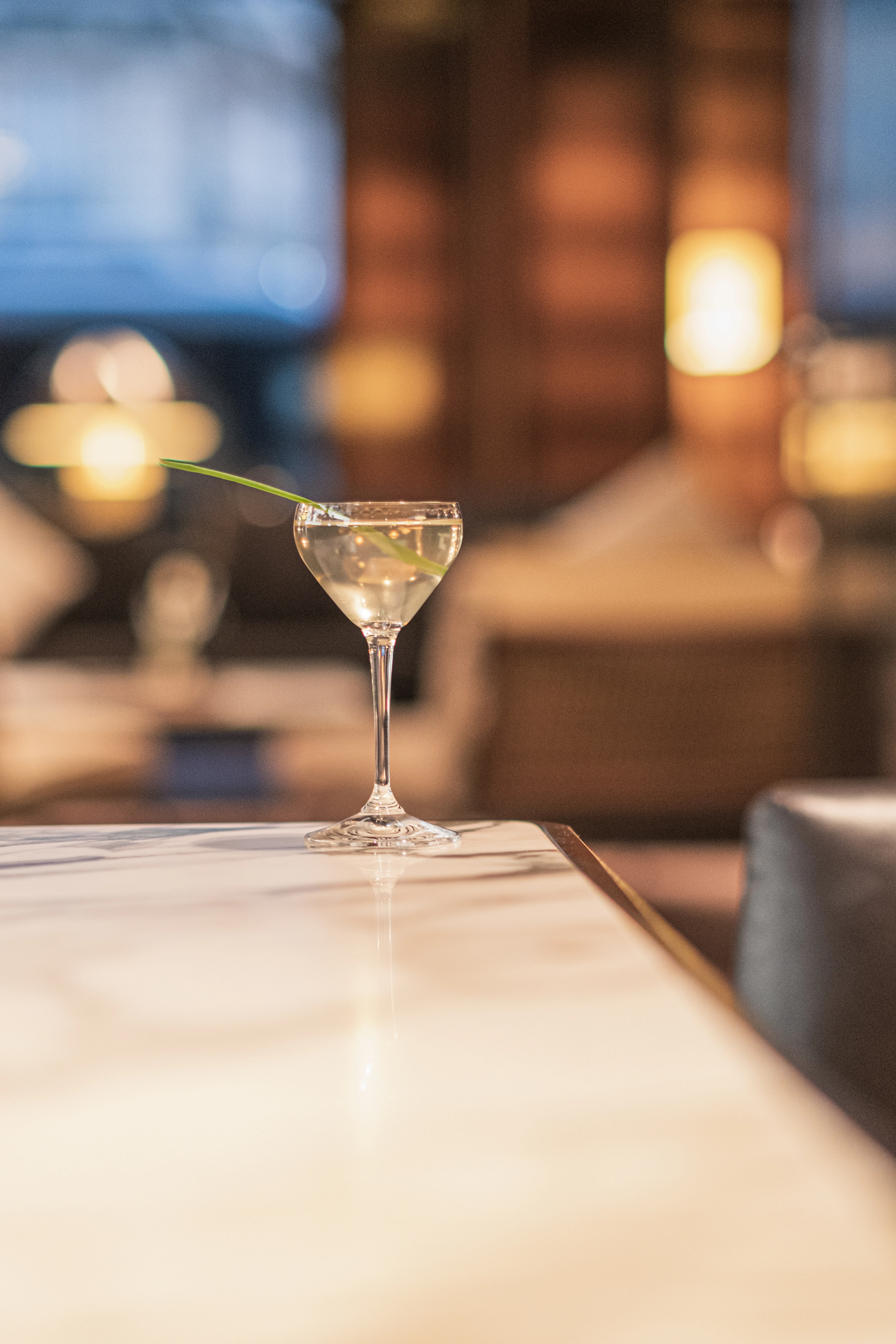 Cocktail glass on a marble bar top
