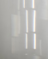 Close-up of delicate horizontal lines in soft gray tones, resembling the gentle flow of time.