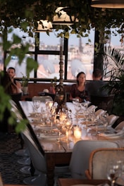 a dining room with a table set for a meal