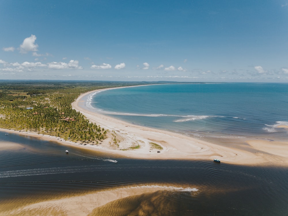 an aerial view of a beach and a body of water