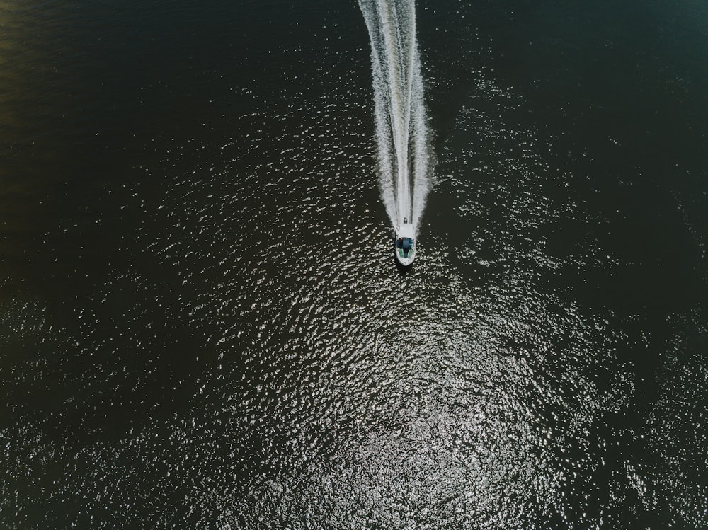 a boat is traveling in the middle of the water