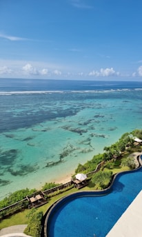 a view of the ocean from the top of a building