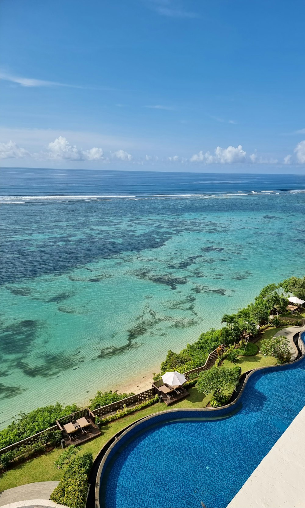 a view of the ocean from the top of a building