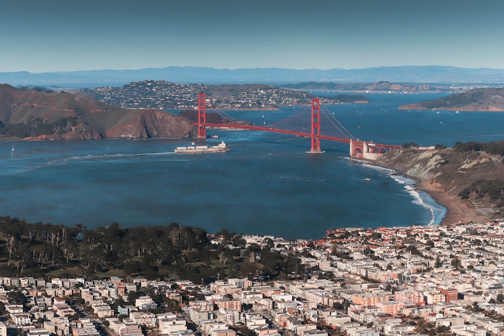 a view of the golden gate bridge from the top of a hill