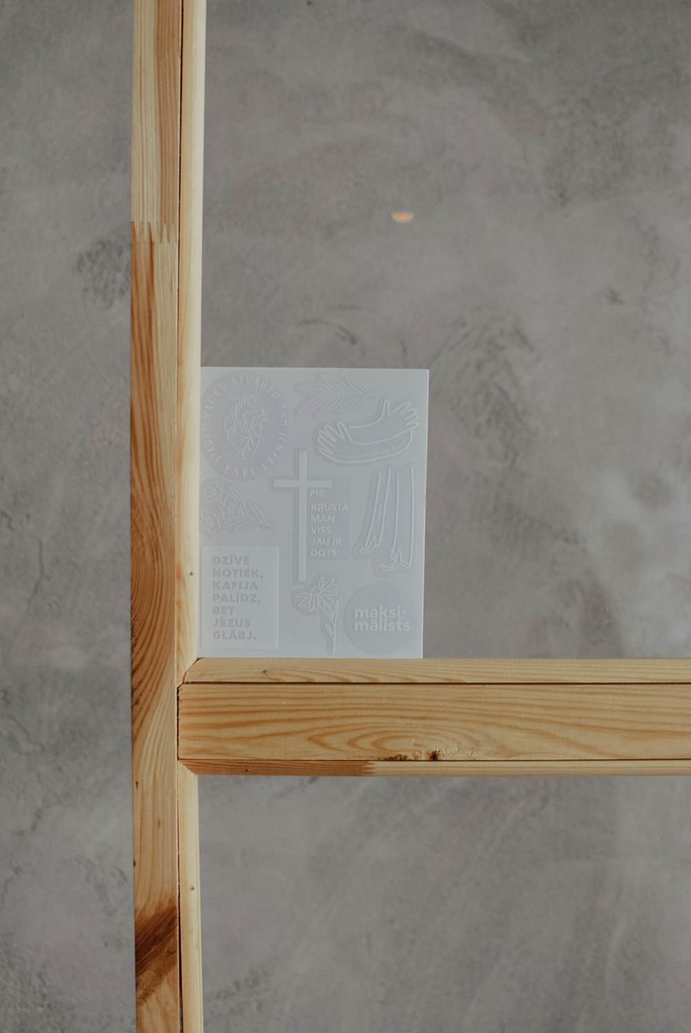 a piece of paper sitting on top of a wooden frame