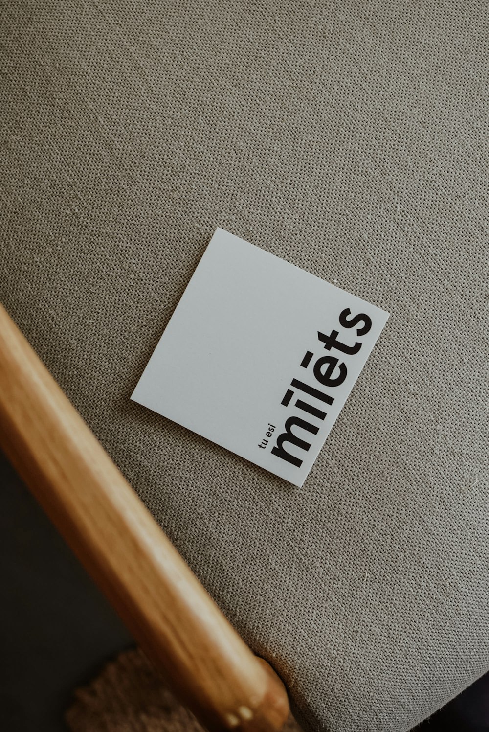 a piece of paper sitting on top of a chair