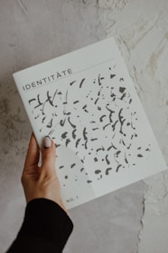 a person holding a book in their hand