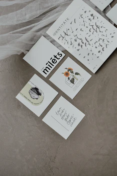 A set of minimalist prompt cards arranged neatly on a linen cloth, inviting thoughtful reflection.