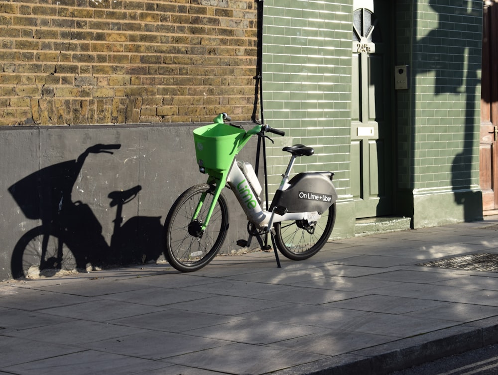 a bike parked on the side of a street next to a building