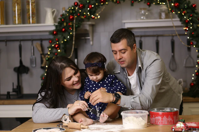 A warm family kitchen scene with hands preparing colorful homemade desserts together.