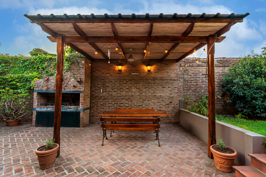 Wooden bench under a backyard pergola