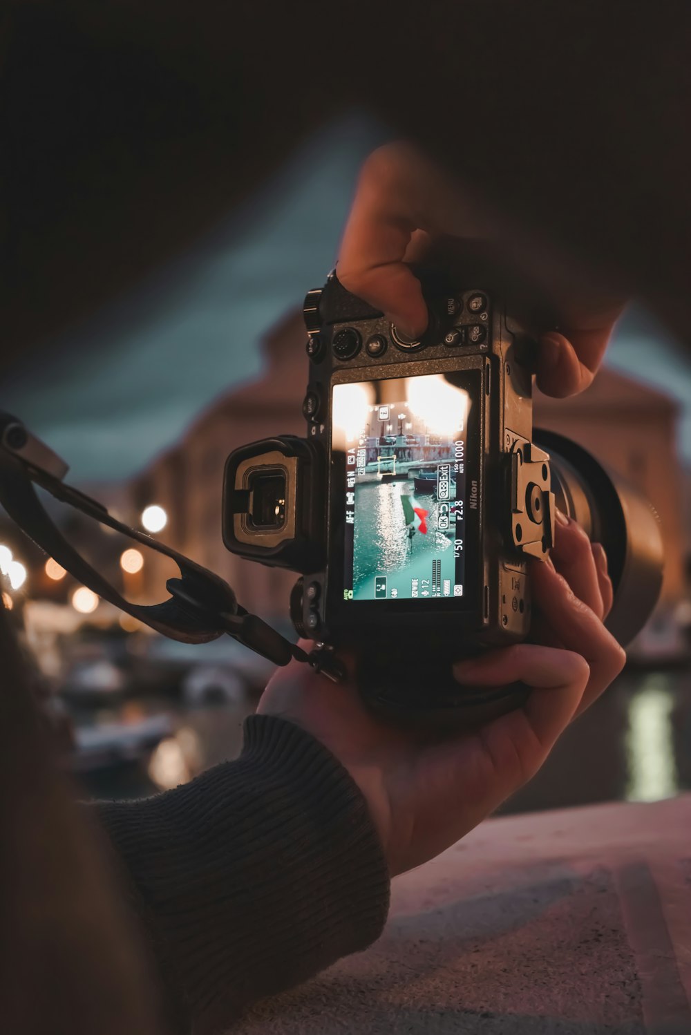 a person taking a picture of a street with a camera