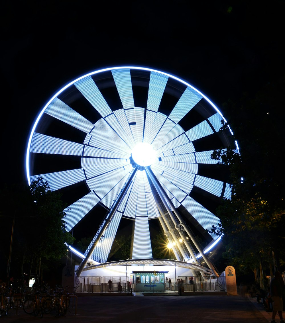 a large ferris wheel lit up at night