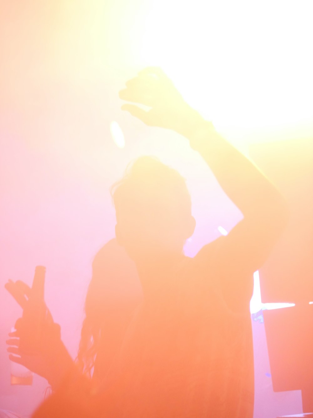 a person holding a cell phone up to their head