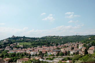 a small town nestled on a hill in the middle of a valley