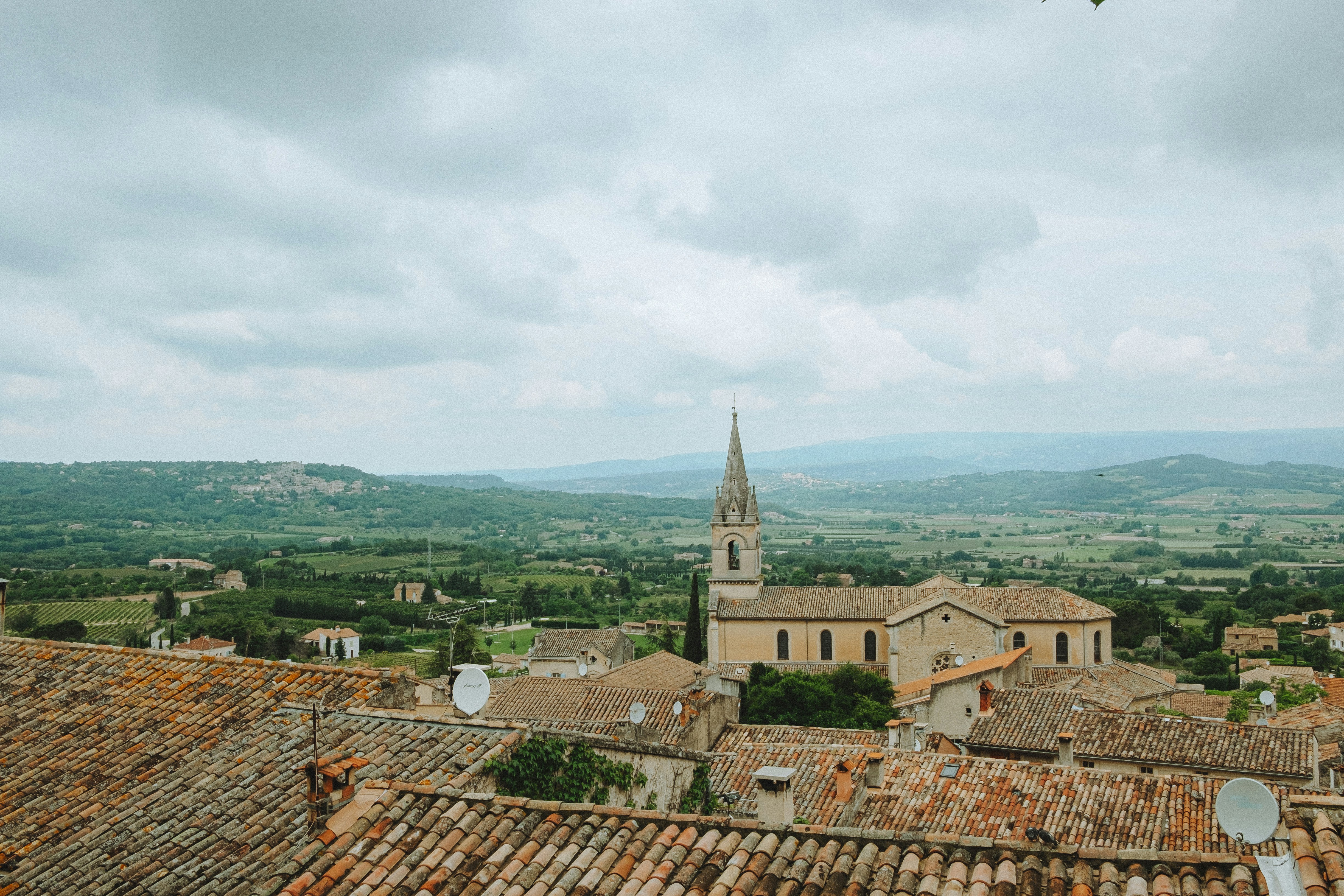 A view of a town with a church tower
