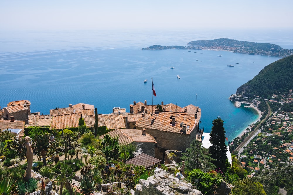 a castle overlooking a body of water surrounded by trees