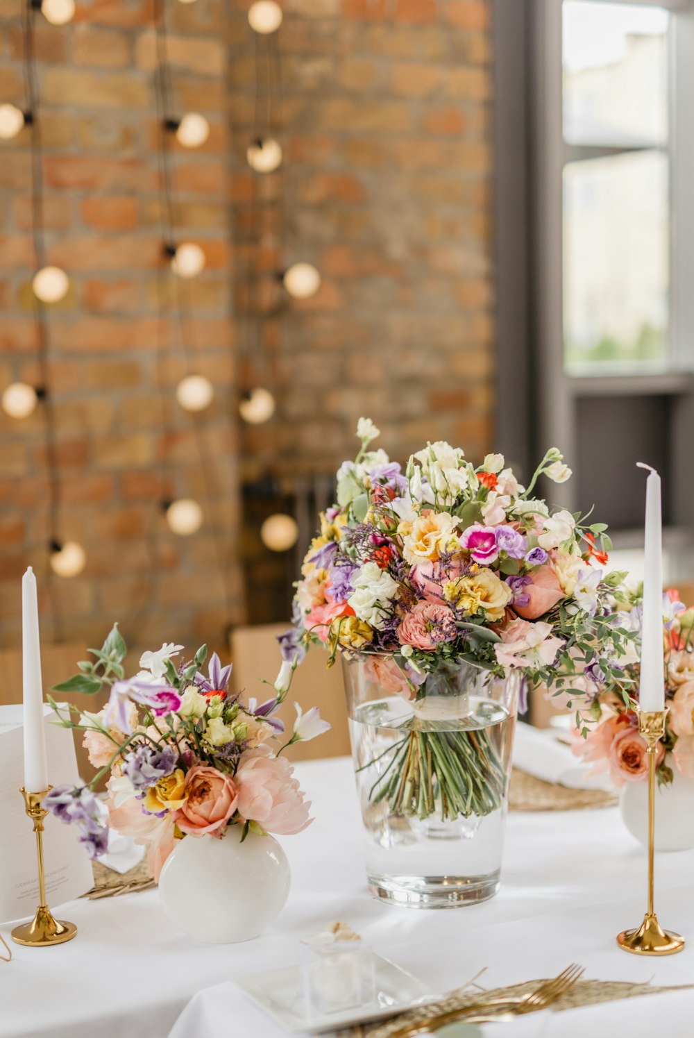 a table topped with a vase filled with flowers