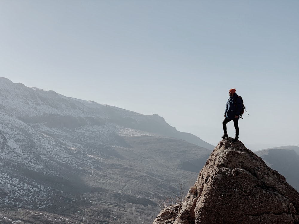 a person standing on top of a mountain