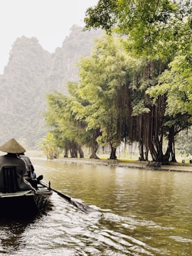 a person riding a boat down a river