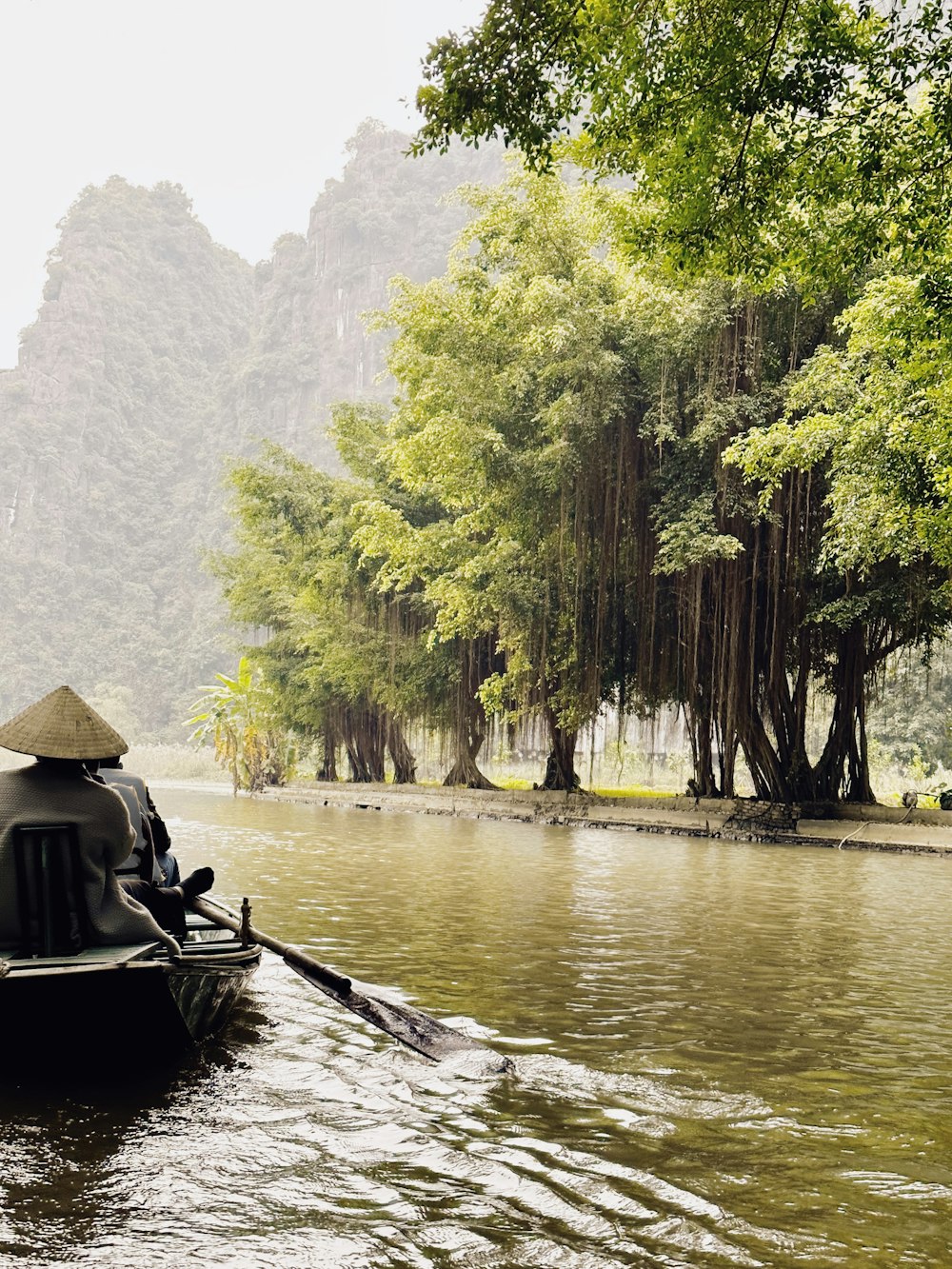 a person riding a boat down a river