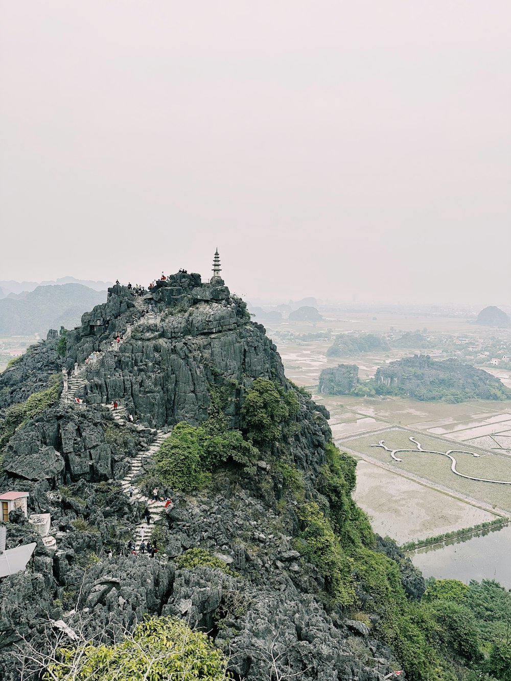 a mountain with a small village on top of it