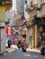 A close-up of a motorbike weaving through congested traffic.