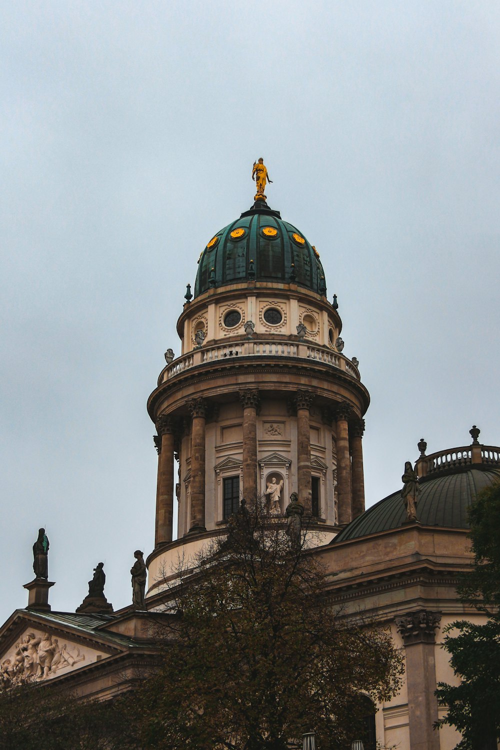 a large building with a green dome on top