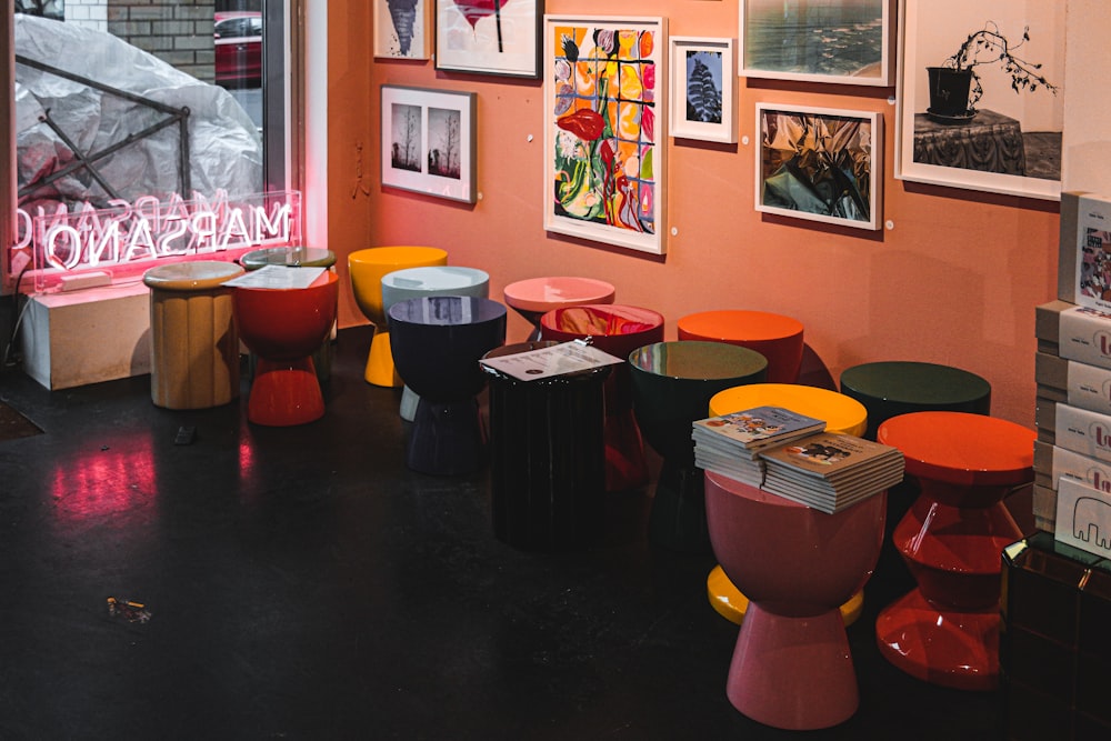 a room filled with lots of different colored stools