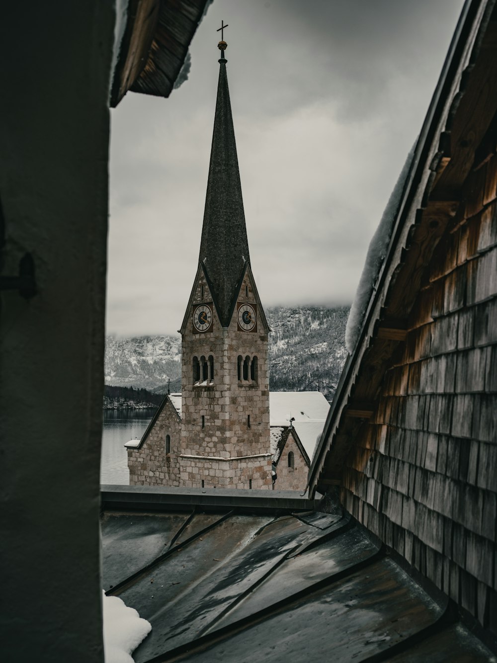 an old church with a steeple on a cloudy day