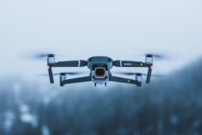 a black and white photo of a flying object