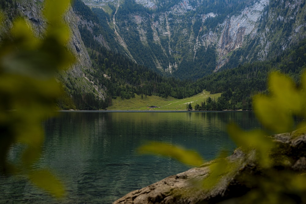 a lake surrounded by mountains and trees