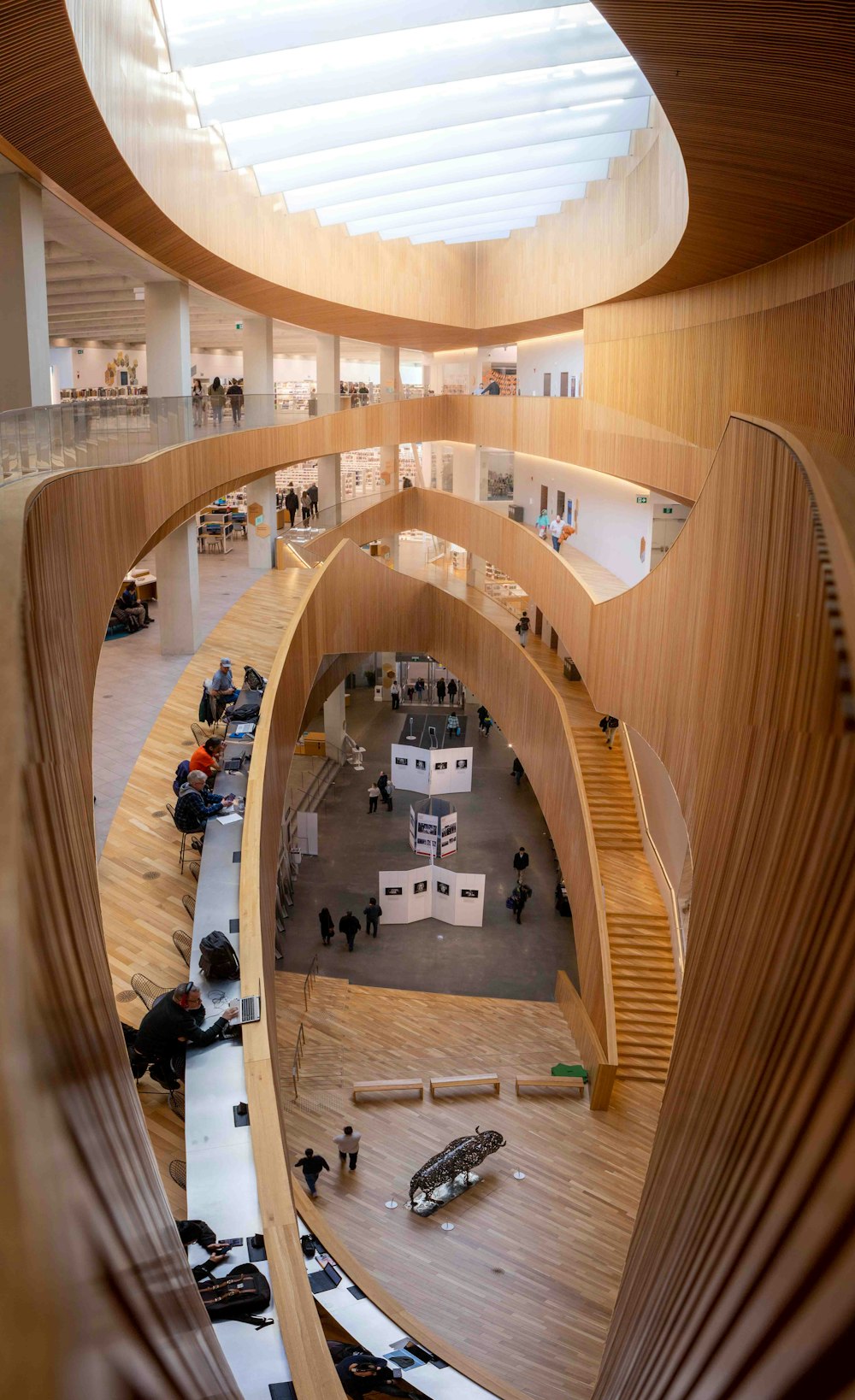 a large wooden building with a spiral staircase