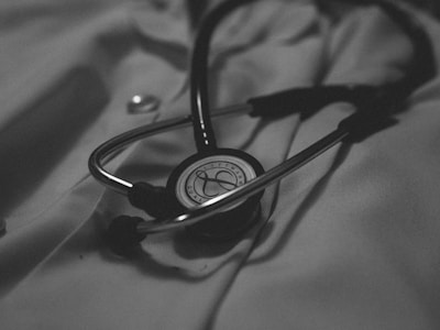 Close-up of a sleek stethoscope resting on a clean white surface, symbolizing trust and quality.