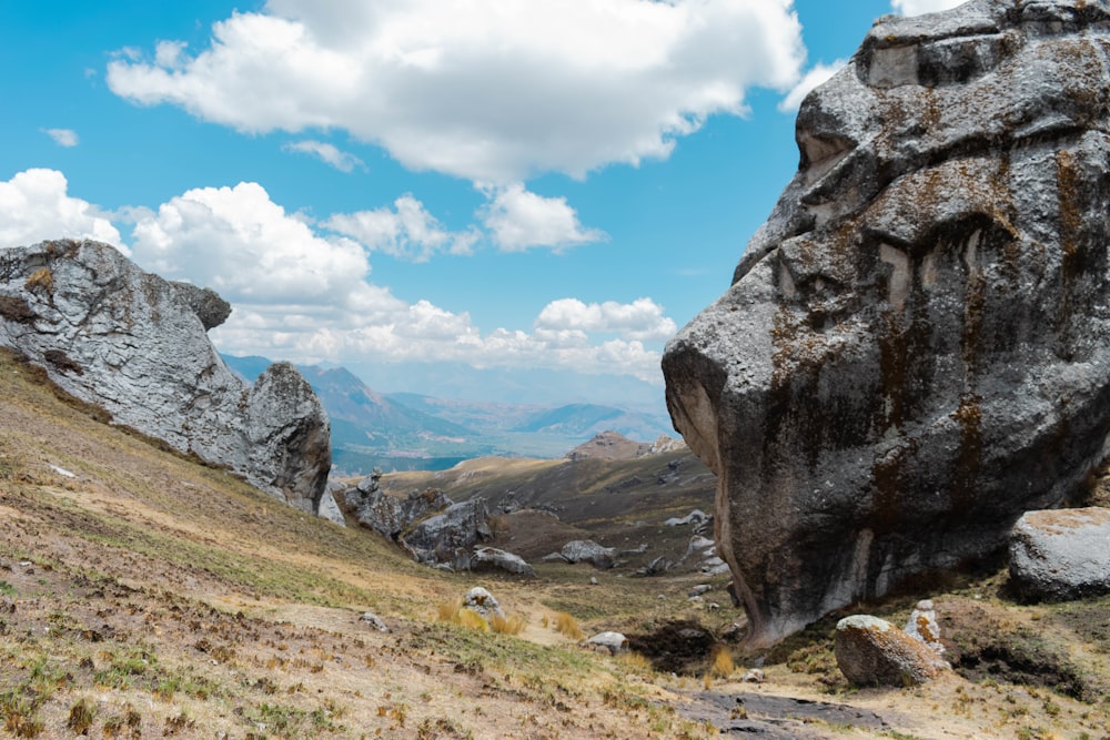 a large rock formation on the side of a mountain