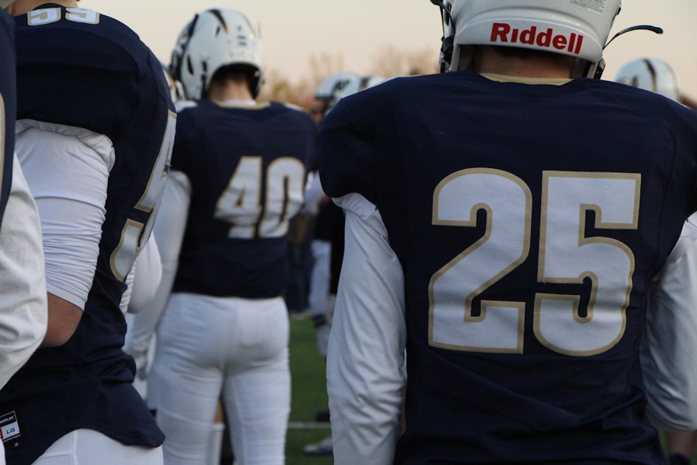 a group of football players standing next to each other