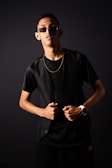 a man wearing sunglasses and a black shirt