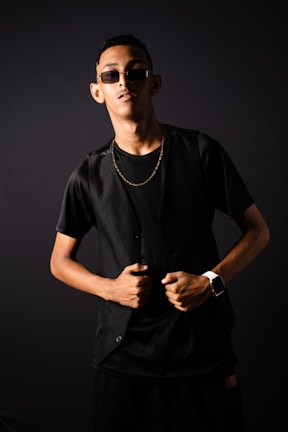 a man wearing sunglasses and a black shirt