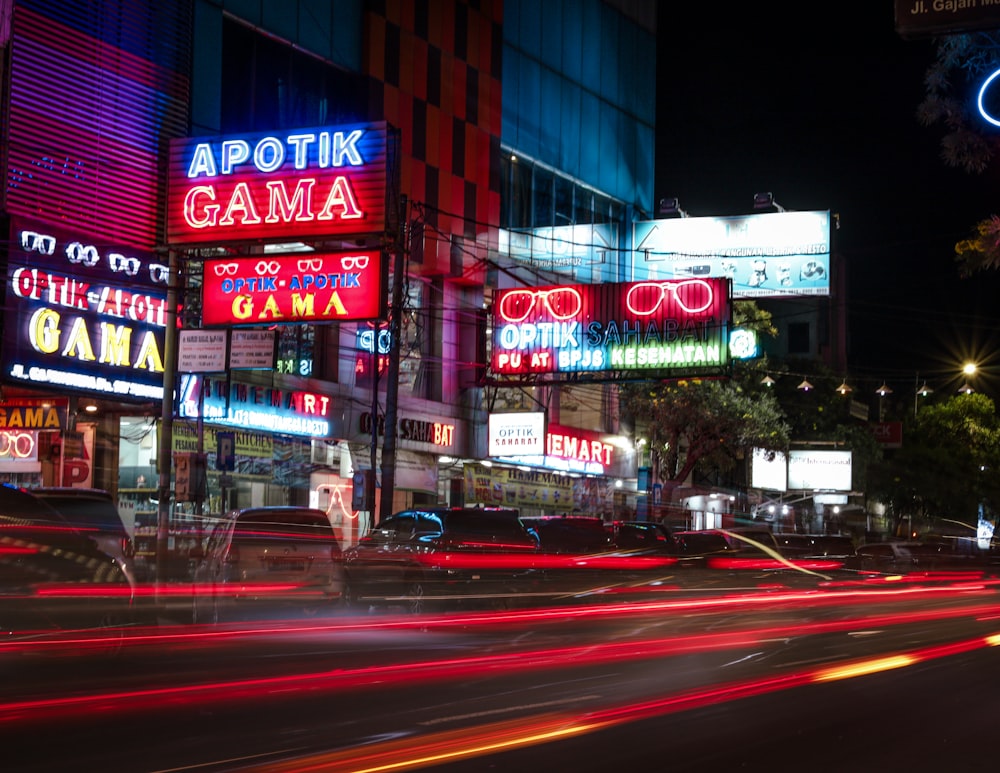 a city street filled with lots of neon signs