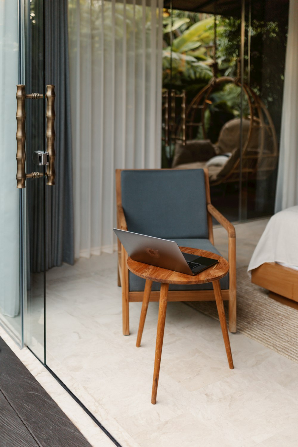 a chair sitting in front of a sliding glass door