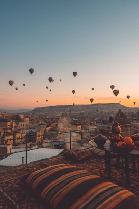 a bunch of hot air balloons flying in the sky