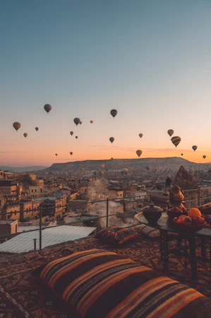 a bunch of hot air balloons flying in the sky