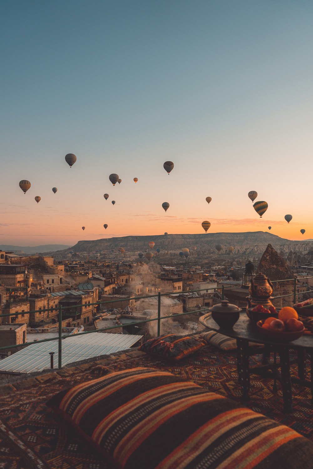 a bunch of hot air balloons flying in the sky