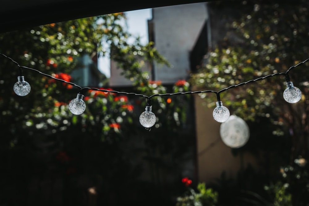 a bunch of lights hanging from a wire