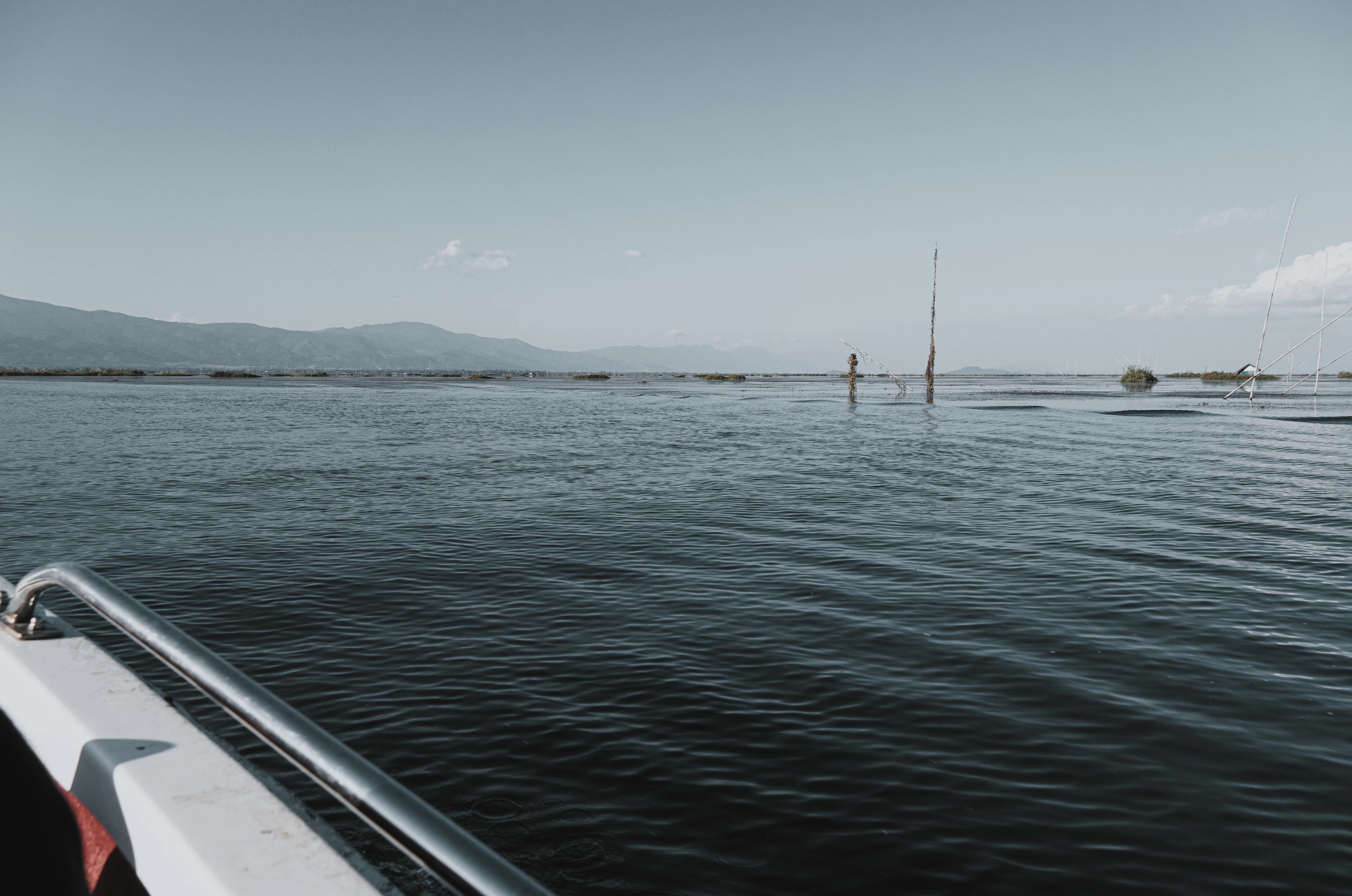 A boat on the calm water of Loktak Lake