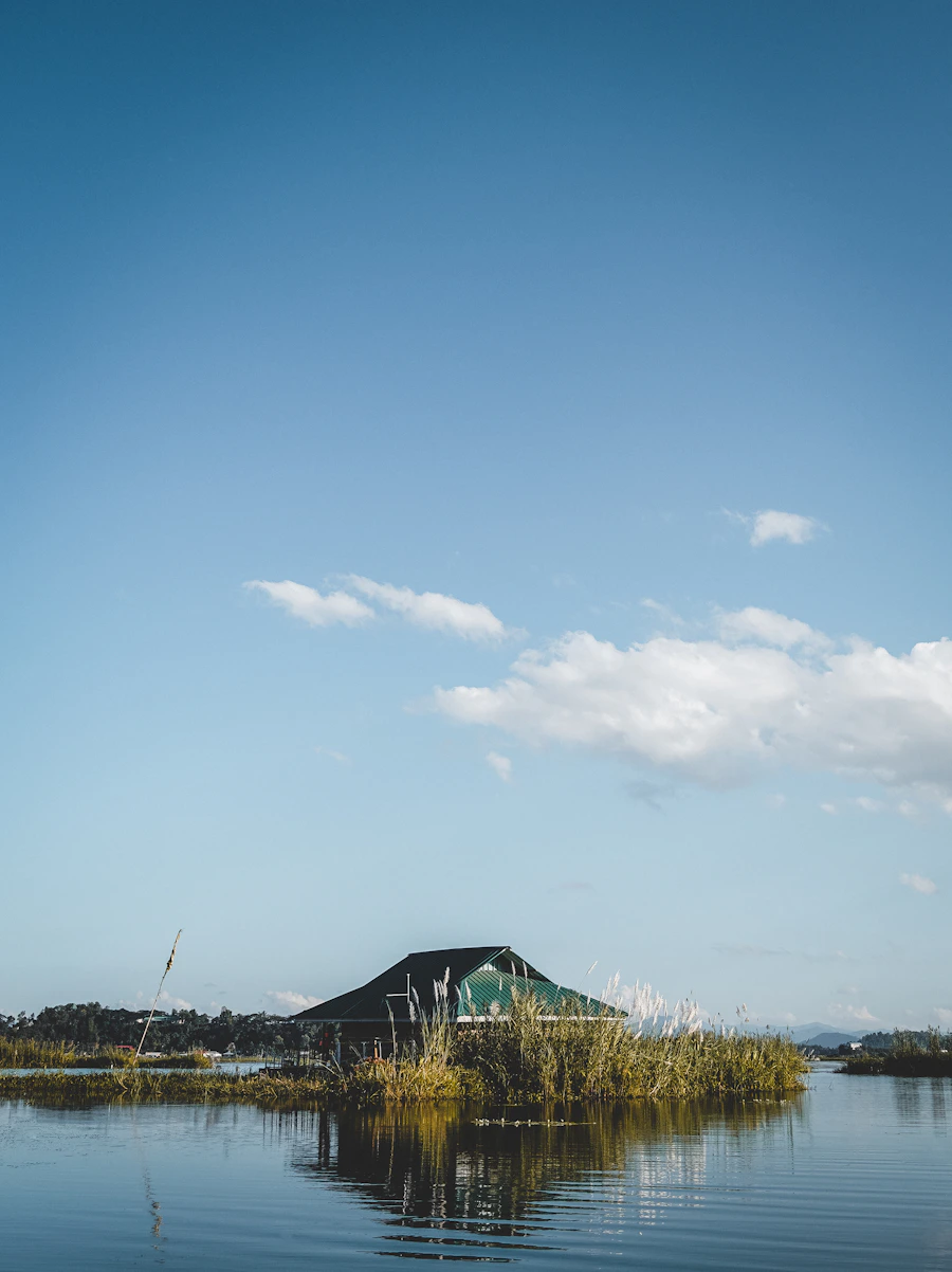 Floating islands and a lakeside home on Loktak Lake