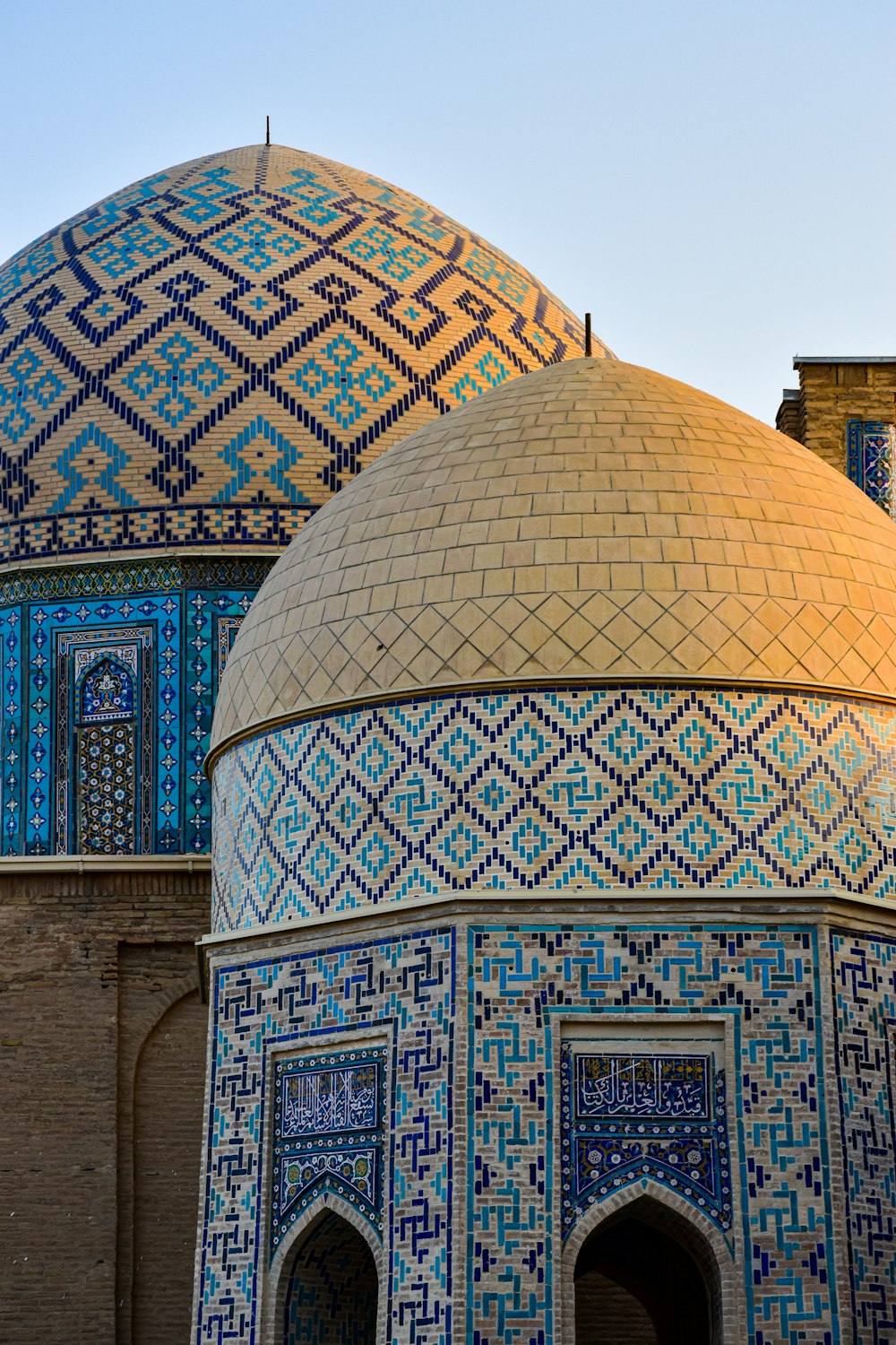 a close up of a building with a blue and gold dome