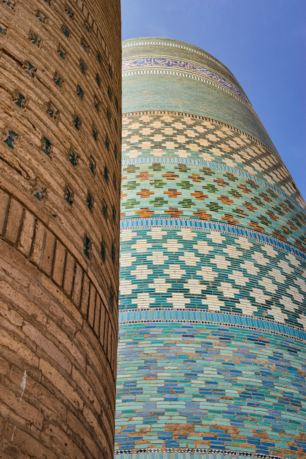 a tall building with a very colorful design on it's side