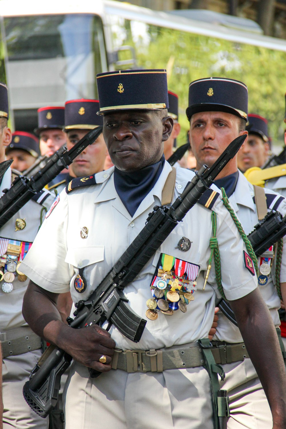 a group of men in uniform holding guns